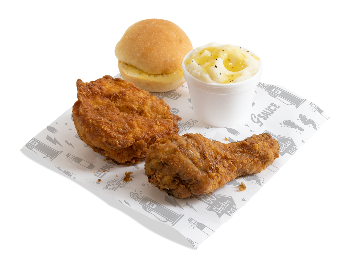 Two pieces of golden fried chicken, mashed potatoes and butter roll.